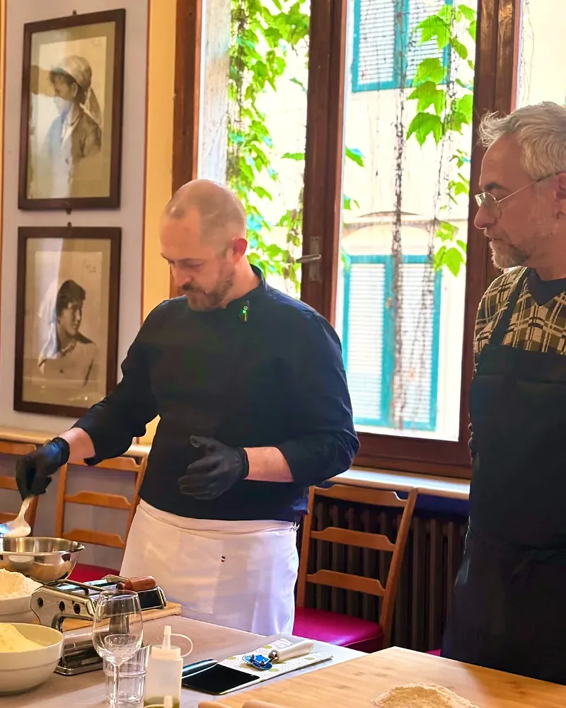 Chef teaching guests to make fresh pasta inside the Royal Victoria Hotel in Pisa
