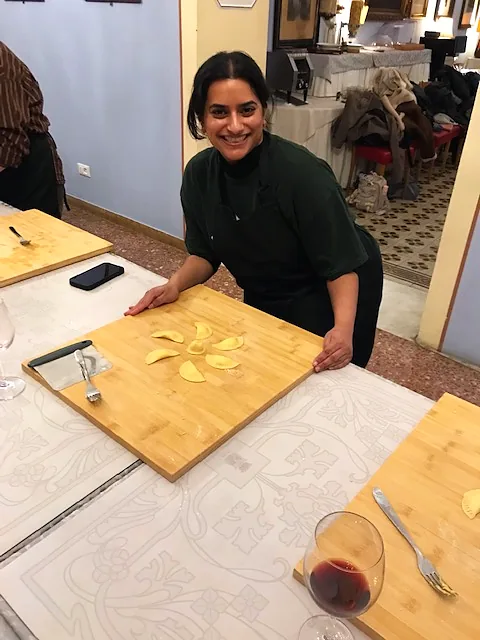 Guest cutting fresh pasta on the board
