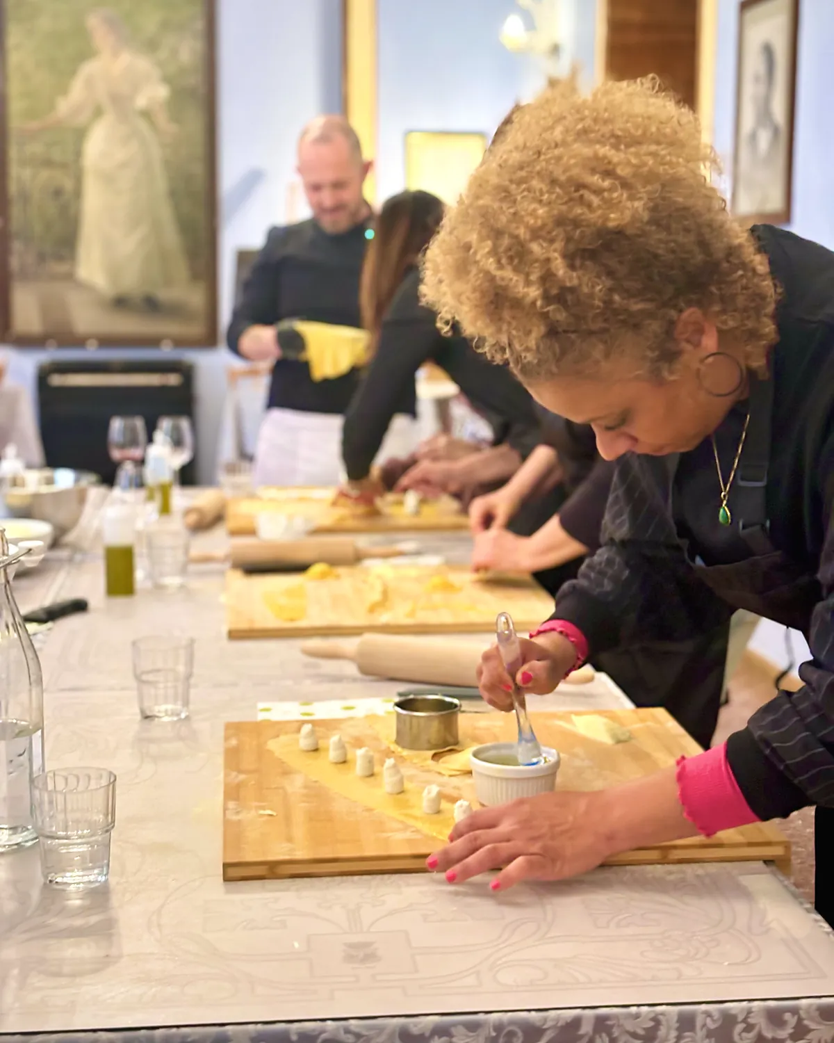 Guest filling fresh tortelli by hand