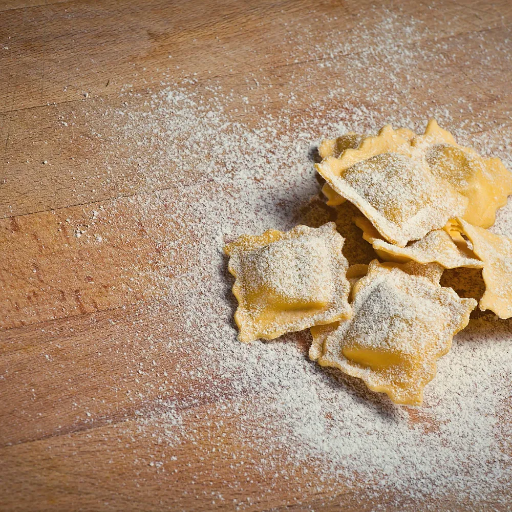 Freshly made ravioli dusted with flour